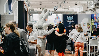 Mascotts taking a photo with participants